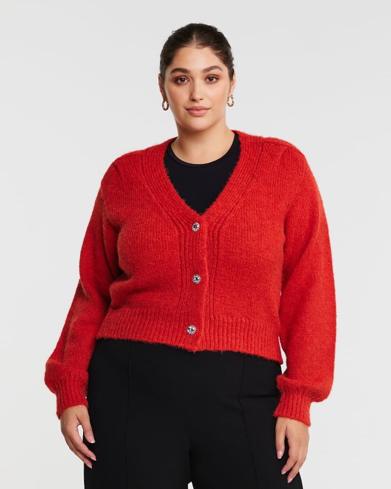 Front of a model wearing a size 24W Embellished Caridgan in Pomegranate by Estelle. | dia_product_style_image_id:315716